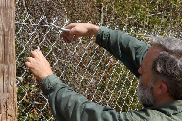 Vinyl chain link fence installation in Puyallup WA