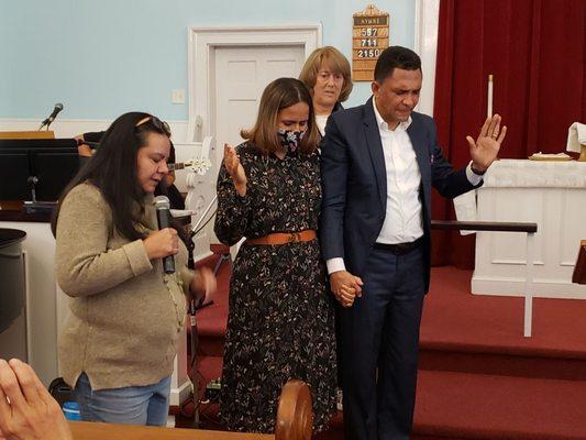 Pastor Jose and Wendy, Healing Evangelists from the Dominican Republic receiving prayer from  Donna Meier., translator left.