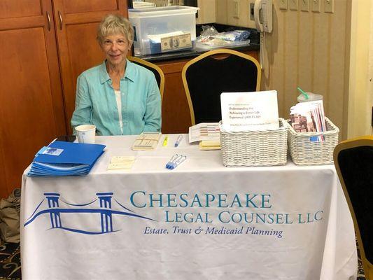 Our friendly and helpful staff at the check-in table at a seminar on Estate Planning.