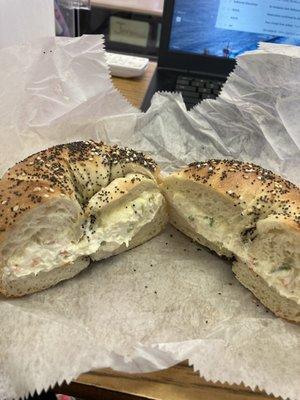 Cream cheese and butter on an everything bagel