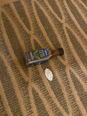 Drink and sticker left on floor