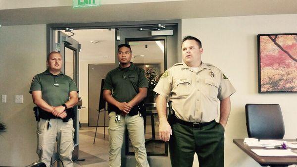 Security Enforcement Group in olive shirt and khaki trousers