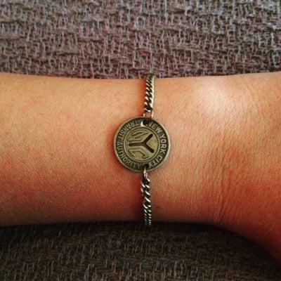 Bracelet by Byrdie jewelry. Vintage NYC subway token.