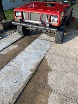 All mud and algae removed from a Jeep owners driveway.