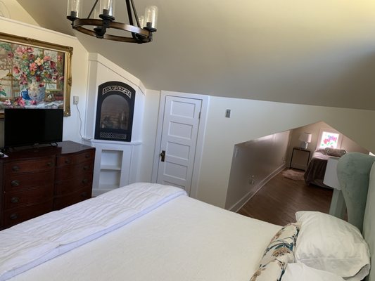 Azalea room fireplace and small nook with single bed.