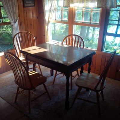 breakfast area. there's a picnic table near the barbecue outside as well.