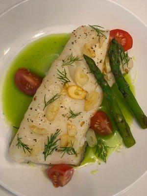 Seabass with Garlic chips, parsley and dill oil served with asparagus and cherry tomatoes