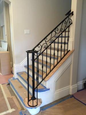 Stair railing with a basket