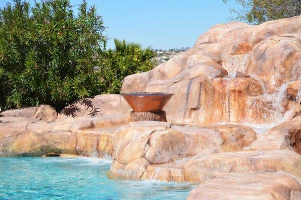 Outdoor pool rock formations and waterfalls