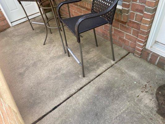 Dirty Patio with black mildew and mold, prior to treatment.