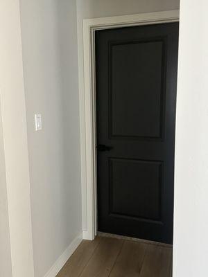 Painted interior bedroom door, baseboards and walls