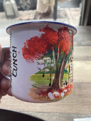 Cute hand painted old-fashioned tin cup advertising Minia's