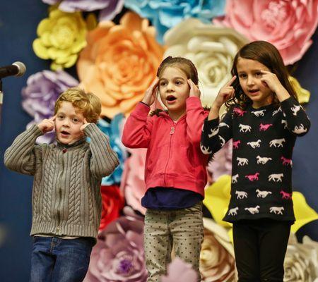 Kindergarteners sing in Spanish at the Talent Show