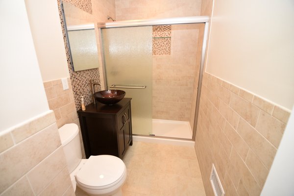 Updated hall bathroom with walk in shower