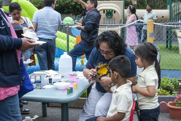 Teachers volunteering to do Face Painting