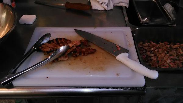 Chopping some top of the line Steak Meat!