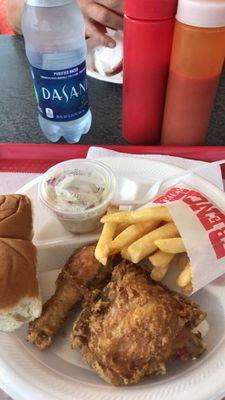 Thigh drumstick snack with coleslaw fries and soft rolls