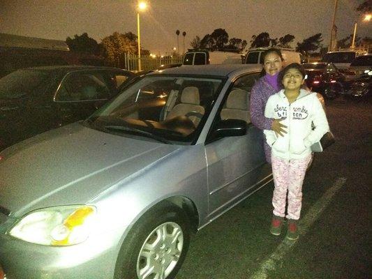 A hard working  Mother and her sweet  little daughter got this reliable gas saver Honda civic,