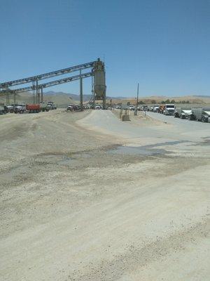 Long lines of trucks for the hot plant, and outbound scale