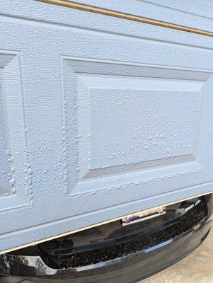 Paint bubbling up on garage door.