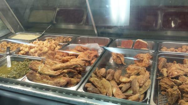 Freshly fried catfish, shrimp, oysters and chicken w green beans potato wedges and hush- puppies