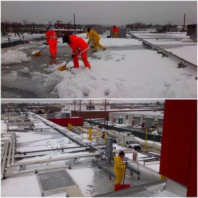 Rooftop snow removal following a blizzard.