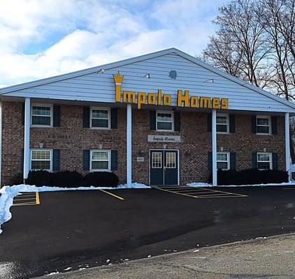 The Impala Homes building, shining like a beacon of light on the Seybold Road corridor.