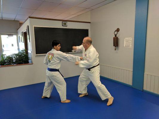 Adult karate students practicing kata (forms) application