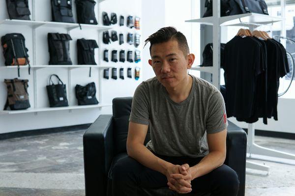 Nick, founder of Banker Supply, seated in the Los Angeles store's lounge area.