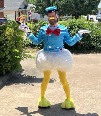 Another pose outside, this time with Mitch spreading his "wings" wide, showing off his bright yellow tights and oversized bow tie.