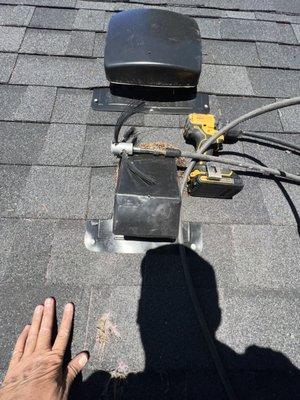 Dryer vent cleaning on the roof