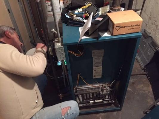 Our heating service technician repairing a gas furnace for a private home owner in bellmore ny.