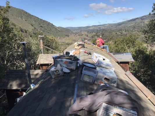 a cabin here in carmel valley wood shingle remover installing asphalt shingles 30 years by RE ROOF ALL AMERICAN