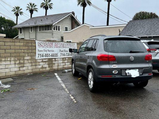 Parking in the back. Even in the rain, it's covered once you get to the neighbors building