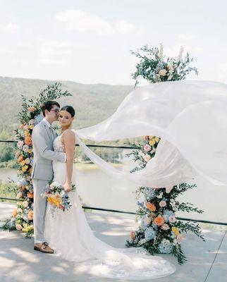 Morilee Jill with an angel wing veil added at Horsehead Lake Lodge