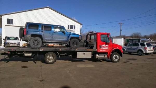 Towed in a heavy Hummer H3. No problem for our flatbed tow truck!