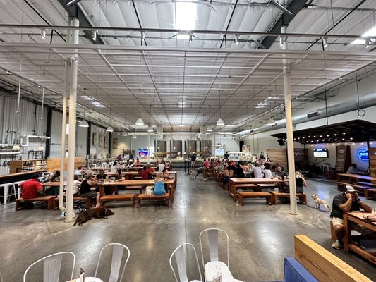 Large tasting room with lots of seating and live music