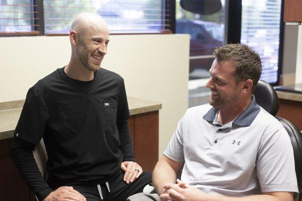 Spokane dentist Dr. Cochran explaining the benefits of veneers