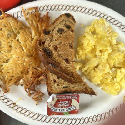 Hash browns, scrambled eggs, raisin toast