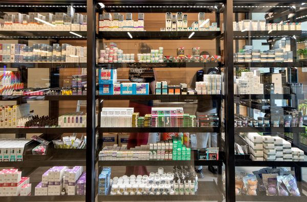 The tinctures, capsules, and topicals display, to the right when you walk in.