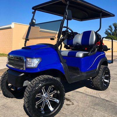 Blue alpha body lifted club car golf cart