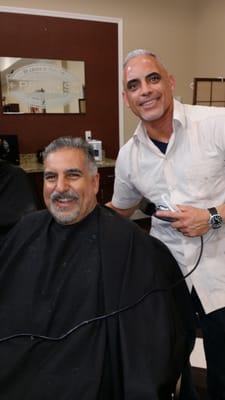 Fernando from Univision sports with Robert lozano at Primos Barbershop.