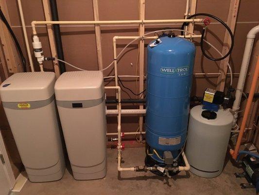 Water Softener Chemical Feed Injection system and Well-x-troll pressure tank installation.