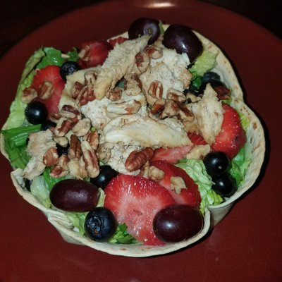 Chicken fruit salad in a tortilla bowl.