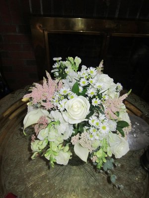 Beautiful white bouquet with pink and green accents with callas from Christopher's Flowers.