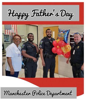 Manchester police officers  enjoy Father's Day balloon bouquet delivery.