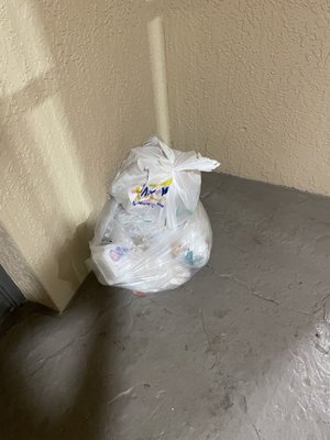 Garbage left outside our door.  We checked in around 5pm, this shouldn't still be here.