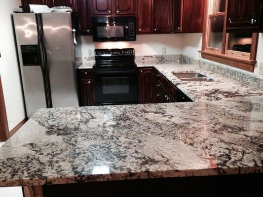 Delicatus granite kitchen countertops. Kitchen countertops fabricated by Rocky Tops Granite & Marble. Stone supplied by Ecstatic Stone.