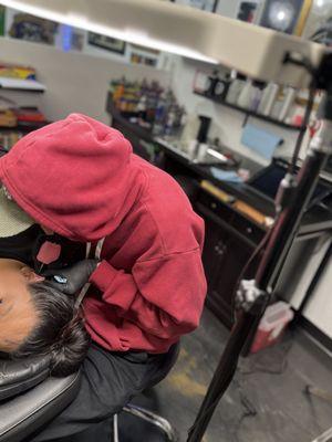 Josh inking up the side of the face and ear