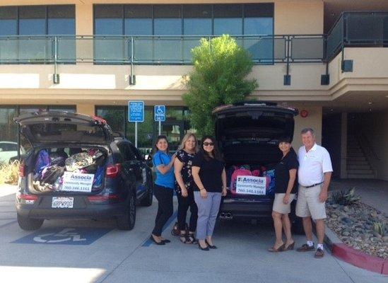 Indio staff helped deliver backpacks and school supplies to needy children at Coral Mountain Academy.